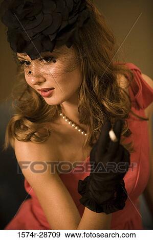 Young prostitute in veil holding a cigarette View Large Photo Image Stock Photo - Young prostitute in veil holding a cigarette. Fotosearch
