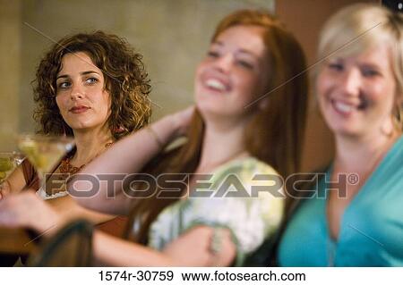 Young woman looking at mother and sister View Large Photo Image Stock Photo - Young woman looking at mother and sister. Fotosearch