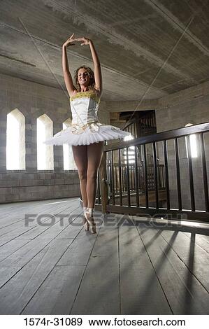 Stock Photo - Young woman practicing ballet dancing. Fotosearch