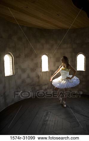 Stock Photo - Young woman practicing ballet dancing. Fotosearch