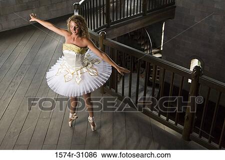 Young woman practicing ballet dancing View Large Photo Image Stock Photograph - Young woman practicing ballet dancing. Fotosearch