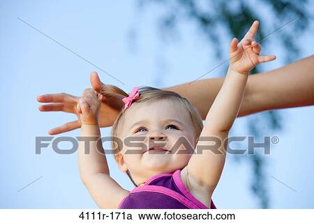 Baby girl holding her mother's hand View Large Photo Image Stock Image - Baby girl holding her mother's hand. Fotosearch