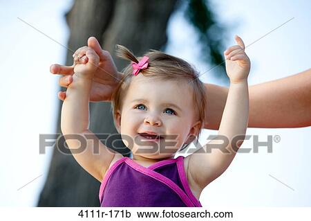 Baby girl holding her mother's hand View Large Photo Image Stock Image - Baby girl holding her mother's hand. Fotosearch