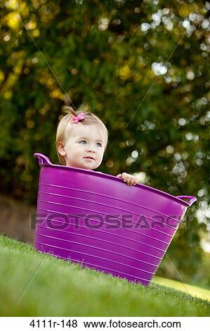 Baby girl peeking from a bathtub, Traverse City, Grand Traverse County, Michigan, USA View Large Photo Image Stock Photo - Baby girl peeking from a bathtub, Traverse City, Grand Traverse County, Michigan, USA. Fotosearch