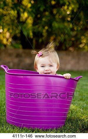 Baby girl peeking from a bathtub, Traverse City, Grand Traverse County, Michigan, USA View Large Photo Image Stock Photograph - Baby girl peeking from a bathtub, Traverse City, Grand Traverse County, Michigan, USA. Fotosearch
