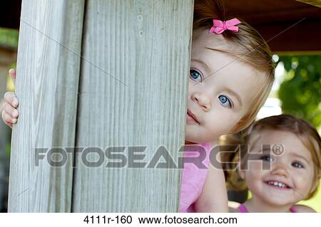 Baby girls in a cabin, Traverse City, Grand Traverse County, Michigan, USA View Large Photo Image Stock Image - Baby girls in a cabin, Traverse City, Grand Traverse County, Michigan, USA. Fotosearch