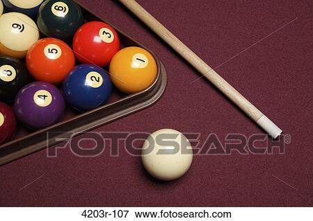 Billiard pool table with cue stick triangle and balls View Large Photo Image Stock Photo - Billiard pool table with cue stick triangle and balls. Fotosearch