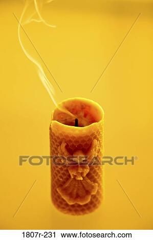 Blown out candle on yellow background View Large Photo Image Stock Image - Blown out candle on yellow background. Fotosearch