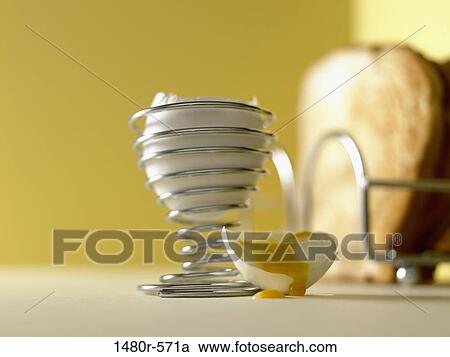 Boiled egg and toast with yolk dripping from egg shell View Large Photo Image Stock Image - Boiled egg and toast with yolk dripping from egg shell. Fotosearch