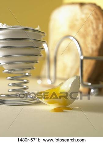 Boiled egg and toast with yolk dripping from egg shell View Large Photo Image Stock Image - Boiled egg and toast with yolk dripping from egg shell. Fotosearch