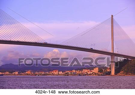 Stock Photo - Bridge across the sea, Bai Chay Bridge, Halong Bay, Vietnam. Fotosearch