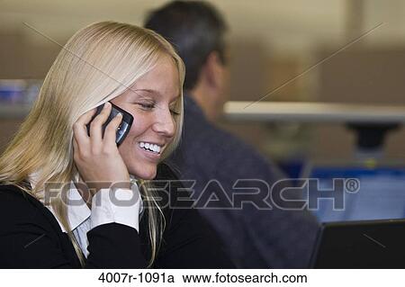 Businesswoman talking on a mobile phone, Florida, USA View Large Photo Image Stock Image - Businesswoman talking on a mobile phone, Florida, USA. Fotosearch