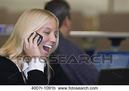 Businesswoman talking on a mobile phone, Florida, USA View Large Photo Image Stock Image - Businesswoman talking on a mobile phone, Florida, USA. Fotosearch