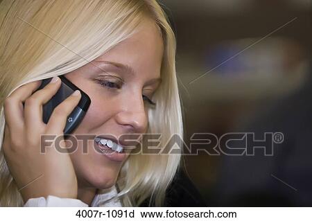 Businesswoman talking on a mobile phone, Florida, USA View Large Photo Image Stock Image - Businesswoman talking on a mobile phone, Florida, USA. Fotosearch