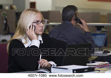 Businesswoman talking on a mobile phone, Florida, USA View Large Photo Image Stock Photography - Businesswoman talking on a mobile phone, Florida, USA. Fotosearch