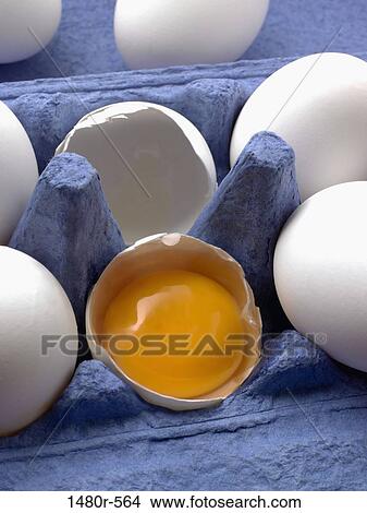 Carton of eggs with a broken egg View Large Photo Image Picture - Carton of eggs with a broken egg. Fotosearch
