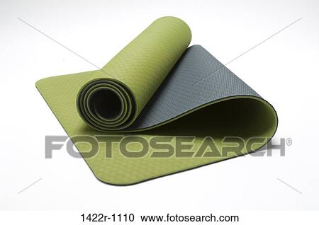 Stock Image - Close-up of a green exercise mat. Fotosearch