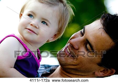 Close-up of a man with his daughter, Traverse City, Grand Traverse County, Michigan, USA View Large Photo Image Stock Image - Close-up of a man with his daughter, Traverse City, Grand Traverse County, Michigan, USA. Fotosearch