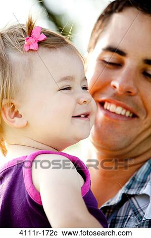 Close-up of a man with his daughter, Traverse City, Grand Traverse County, Michigan, USA View Large Photo Image Stock Image - Close-up of a man with his daughter, Traverse City, Grand Traverse County, Michigan, USA. Fotosearch