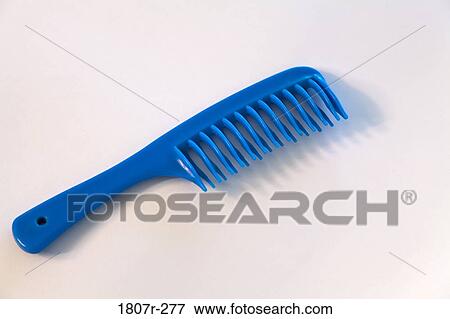 Close-up of a plastic comb View Large Photo Image Stock Photo - Close-up of a plastic comb. Fotosearch