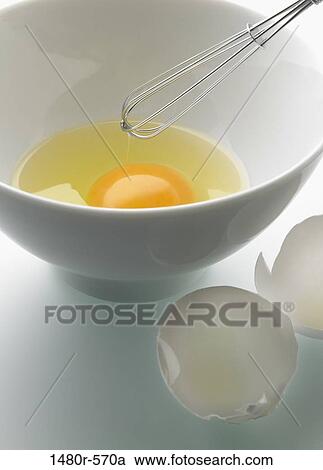Close-up of a wire whisk and egg yolk in a bowl View Large Photo Image Stock Image - Close-up of a wire whisk and egg yolk in a bowl. Fotosearch