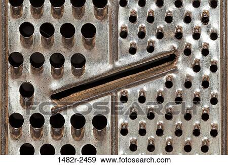 Close-up of an old-fashioned grater View Large Photo Image Stock Photo - Close-up of an old-fashioned grater. Fotosearch