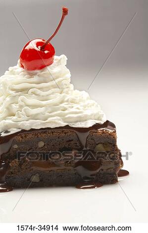Close-up of brownie topped with whipped cream View Large Photo Image Picture - Close-up of brownie topped with whipped cream. Fotosearch