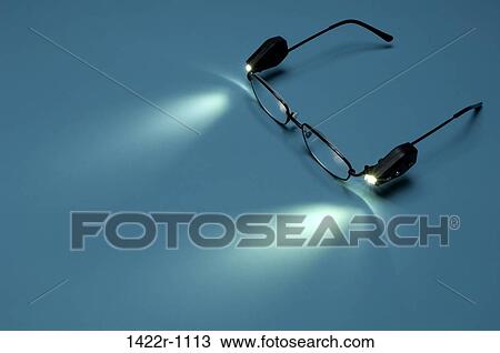 Close-up of eyeglasses with attached lights View Large Photo Image Stock Image - Close-up of eyeglasses with attached lights. Fotosearch