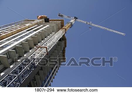 Picture - Crane at a construction site. Fotosearch
