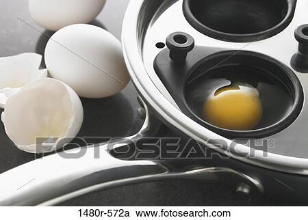 Eggs being prepared for poaching View Large Photo Image Stock Image - Eggs being prepared for poaching. Fotosearch