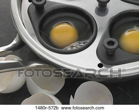 Eggs being prepared for poaching View Large Photo Image Stock Image - Eggs being prepared for poaching. Fotosearch