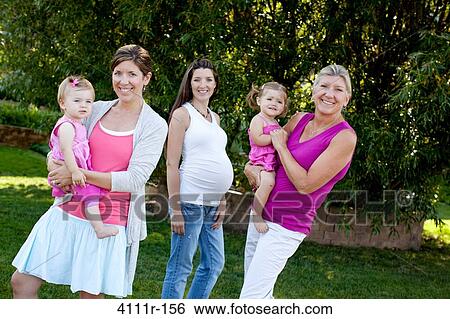 Family in a park, Traverse City, Grand Traverse County, Michigan, USA View Large Photo Image Stock Photograph - Family in a park, Traverse City, Grand Traverse County, Michigan, USA. Fotosearch