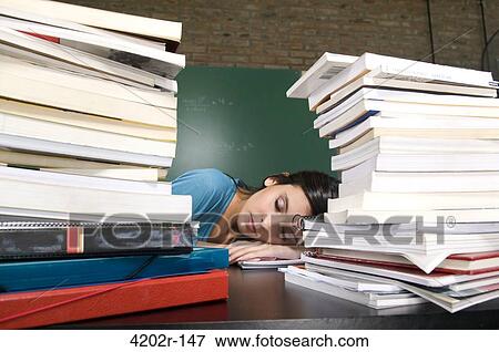 Female student sleeping in a classroom View Large Photo Image Stock Photo - Female student sleeping in a classroom. Fotosearch