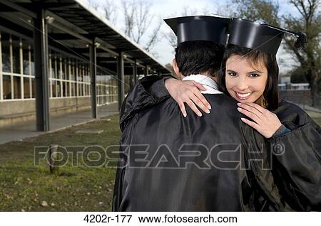 Graduates hugging each other View Large Photo Image Stock Photo - Graduates hugging each other. Fotosearch