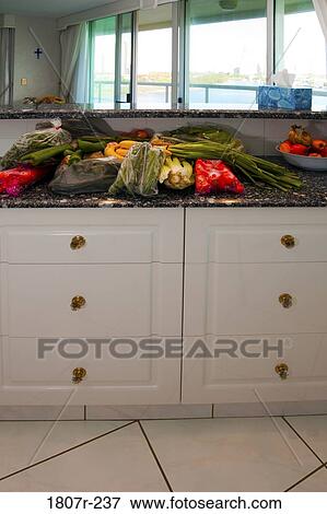 Grocery bags in kitchen View Large Photo Image Stock Photo - Grocery bags in kitchen. Fotosearch