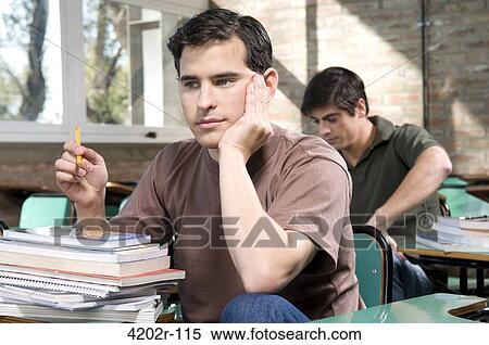 Male students studying in a classroom View Large Photo Image Stock Photography - Male students studying in a classroom. Fotosearch