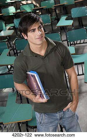 Stock Image - Male university student in a classroom. Fotosearch