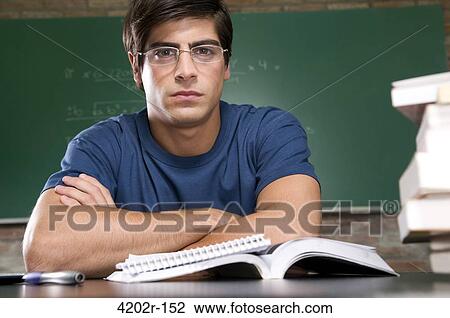 Stock Image - Male university student in a classroom. Fotosearch