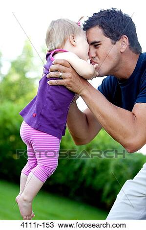 Man playing with his daughter in a park, Traverse City, Grand Traverse County, Michigan, USA View Large Photo Image Stock Image - Man playing with his daughter in a park, Traverse City, Grand Traverse County, Michigan, USA. Fotosearch
