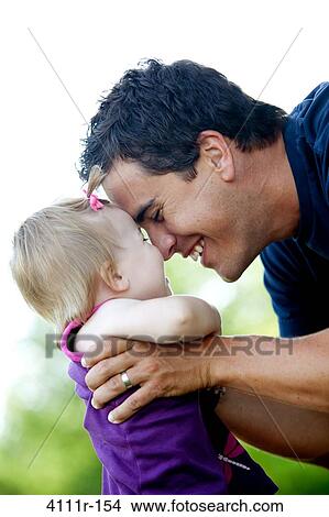 Man playing with his daughter, Traverse City, Grand Traverse County, Michigan, USA View Large Photo Image Picture - Man playing with his daughter, Traverse City, Grand Traverse County, Michigan, USA. Fotosearch