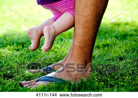 Man with his daughter in a park, Traverse City, Grand Traverse County, Michigan, USA View Large Photo Image Picture - Man with his daughter in a park, Traverse City, Grand Traverse County, Michigan, USA. Fotosearch