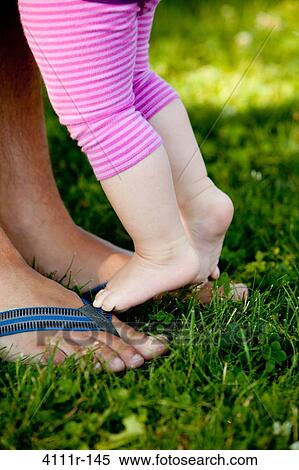Man with his daughter in a park, Traverse City, Grand Traverse County, Michigan, USA View Large Photo Image Stock Photography - Man with his daughter in a park, Traverse City, Grand Traverse County, Michigan, USA. Fotosearch