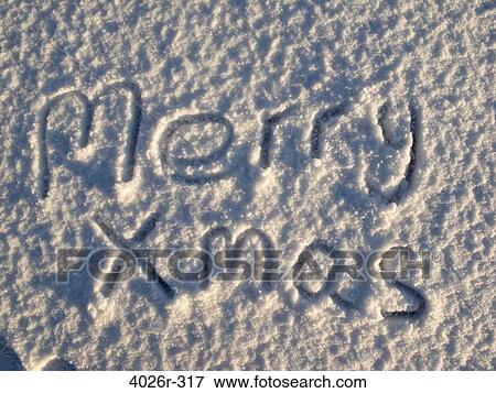 Stock Photo - Merry Xmas written on snow. Fotosearch