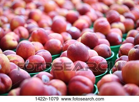 Stock Photo - Nectarines at a market stall. Fotosearch