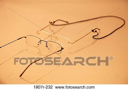 Pair of glasses with reflection on sepia background View Large Photo Image Stock Image - Pair of glasses with reflection on sepia background. Fotosearch