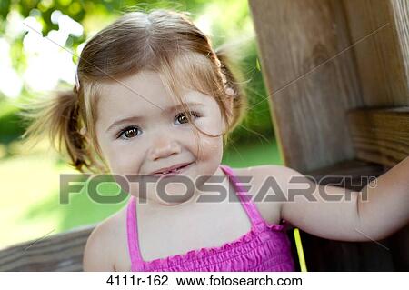 Stock Image - Portrait of a baby girl, Traverse City, Grand Traverse County, Michigan, USA. Fotosearch