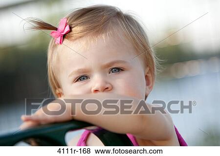 Portrait of a baby girl, Traverse City, Grand Traverse County, Michigan, USA View Large Photo Image Stock Photo - Portrait of a baby girl, Traverse City, Grand Traverse County, Michigan, USA. Fotosearch