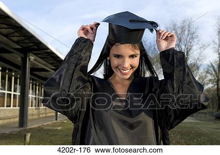 Portrait of a female graduate smiling View Large Photo Image Stock Photograph - Portrait of a female graduate smiling. Fotosearch