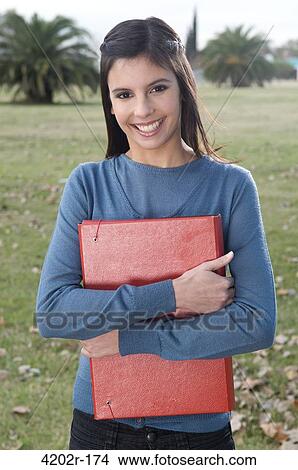 Portrait of a female university student smiling View Large Photo Image Picture - Portrait of a female university student smiling. Fotosearch