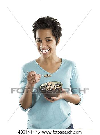 Portrait of a mid adult woman eating fruit salad View Large Photo Image Stock Photography - Portrait of a mid adult woman eating fruit salad. Fotosearch